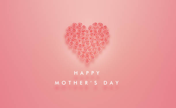 Heart made of pink roses sitting next to Happy Mother's Day message on pink background. Horizontal composition with copy space. Happy Mother's Day concept.