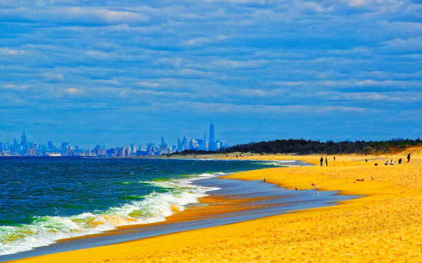 istock Atlantic Ocean shore at Sandy Hook with view of NYC reflex 1220223349
