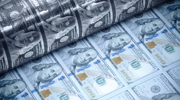 istock One Hundred American Dollars Being Printed - Money Printing Concept 1220223434
