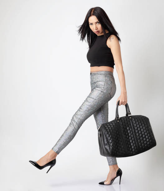 istock Woman walking with her suitcase 1220225968