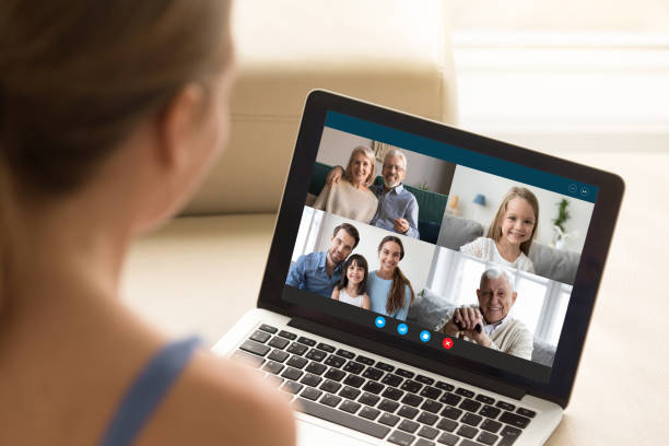 istock Woman communicating with family using laptop and videoconference application 1220226062
