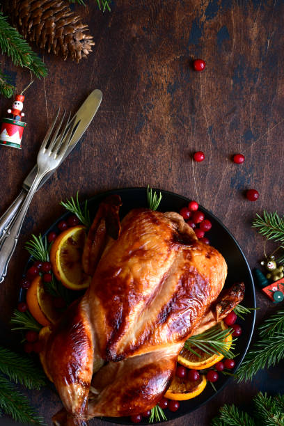 istock Roasted chicken with oranges ,rosemary and cranberries 1220227150
