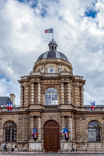 Paris, France - June 10 2019: People walking in front of the entrance of the French Senate (Luxembourg Palace).