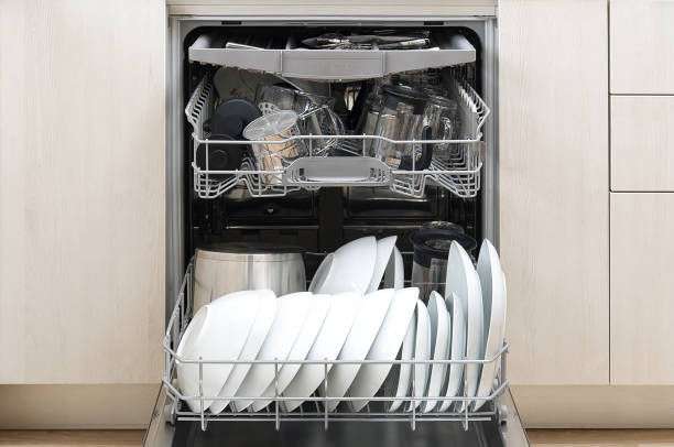istock Full loaded Dishwasher machine. Integrated Dishwasher with white plates front vew. 1220227299