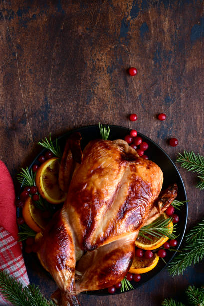 istock Roasted chicken with oranges ,rosemary and cranberries 1220227523