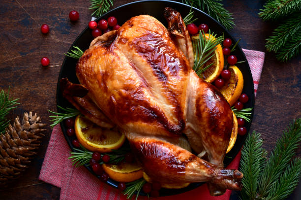 istock Roasted chicken with oranges ,rosemary and cranberries 1220227590