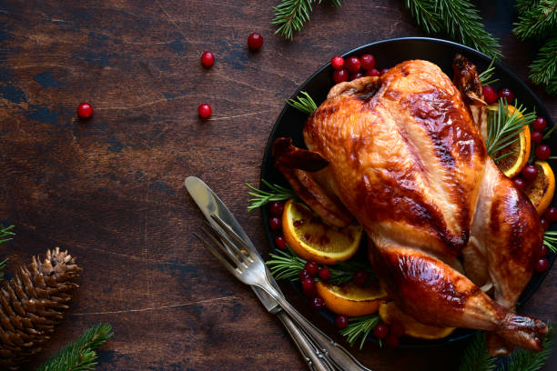 istock Roasted chicken with oranges ,rosemary and cranberries 1220227592