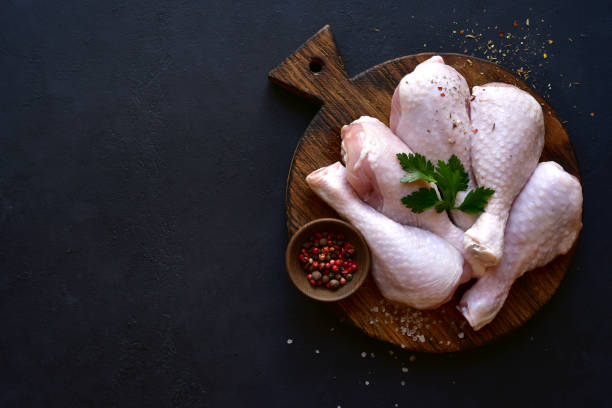 istock Raw chicken legs with spices 1220228187