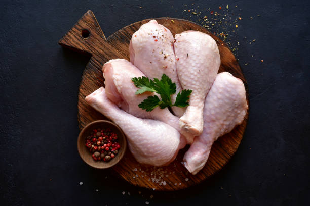istock Raw chicken legs with spices 1220228361