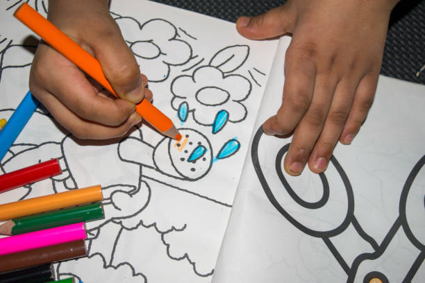 istock Little girl coloring 1220231096