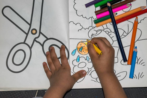 istock Little girl coloring 1220231617