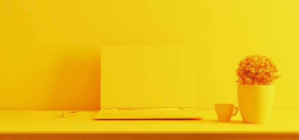 istock laptop screen on desk with plant yellow single color realistic 3D rendering 1220232230