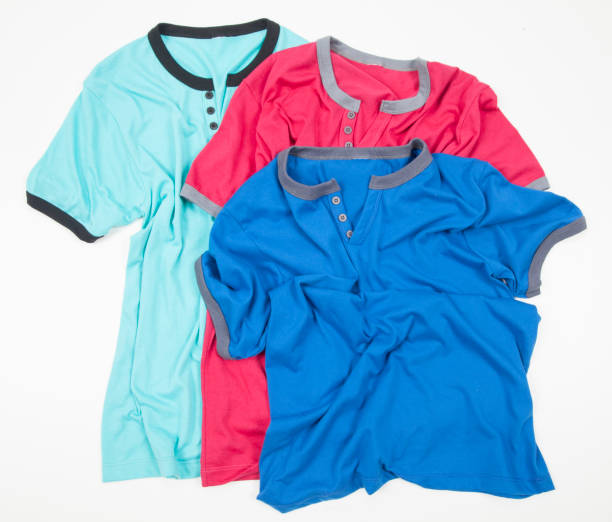 istock set of three different colored shirts for man bent on white background 1220232443