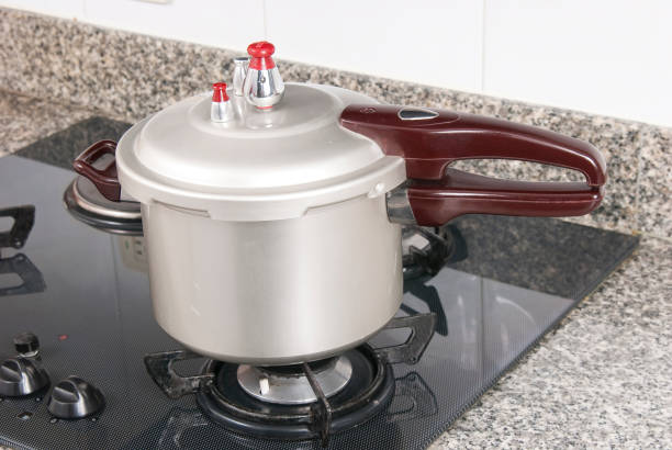 Pressure cooker; photo about stove in the kitchen.