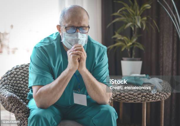 Doctor Surgeon In A Surgical Suit In A Hospital Restroom Stock Photo - Download Image Now