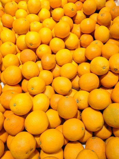 istock many oranges spread in the supermarket 1220238123