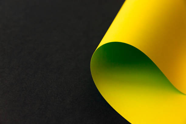 istock Yellow abstract folded paper on black background 1220240284