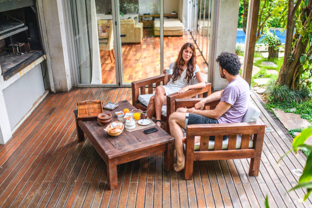 istock Young Couple Having Coffee and Breakfast on Deck 1220240377