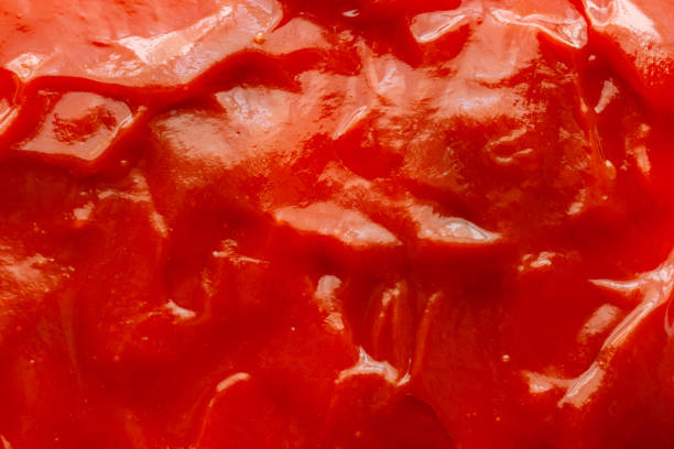 istock Tomato sauce ketchup texture background close up 1220240692