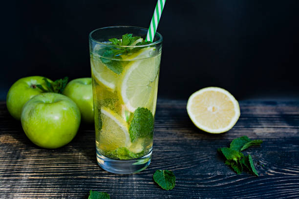 istock Summer refreshing lemonade with mint. Dark wooden background. Side view. 1220240698