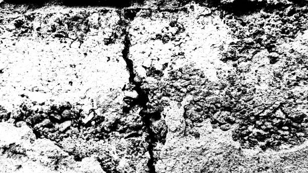 istock stone wall with a crack. black and white texture 1220240752