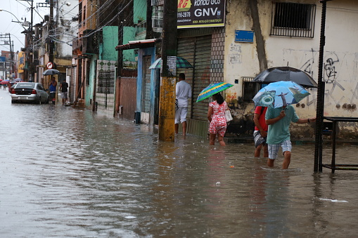 salvador, bahia / brazil - May 10, 2015: People are seen in a flooded area due to heavy rains in the city of Salvador.\