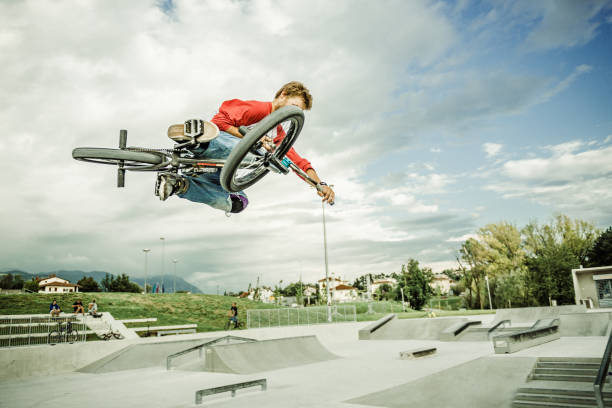 istock bmx rider jumping over a ramp 1220247206