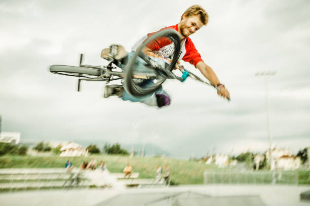 istock bmx rider jumping over a ramp 1220247243