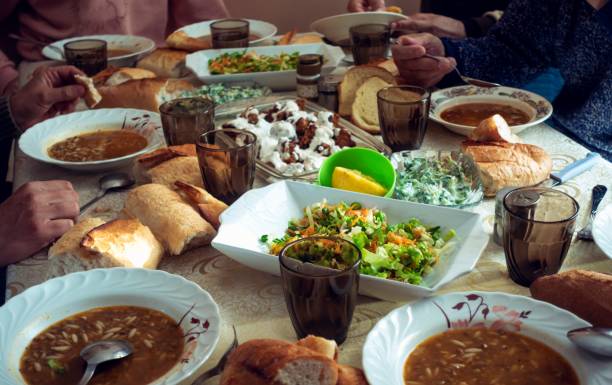 istock Crowded muslim family having dinner in a ramadan day 1220248815