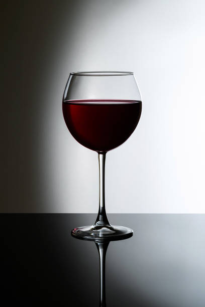 istock Glass of red wine on the gradient background 1220251688