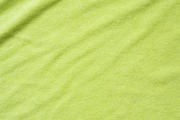 istock Green towel fabric texture surface close up background 1220253335