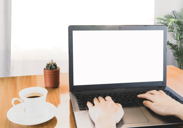 istock Selective focus, hand typing on keyboard,blank screen laptop and coffee on wooden table,work online lifestyle,relax at home with coffee ,home working laptop,work from home concept 1220256745