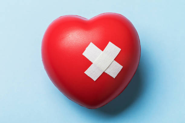 istock Toy heart sealed with medical plaster, top view 1220257467