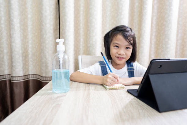 istock Kids learning online in tablet and stay at home 1220257621