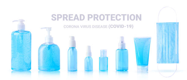 alcohol hand sanitizer gel and medical face mask for spread protection Corona virus Disease (COVID-19) isolated on white background with clipping path stock photo