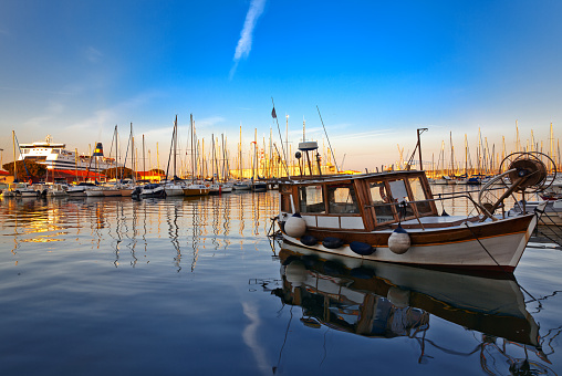 Marina at sunset with promenade and sailing boats in the tourist city of Gijon, Asturias