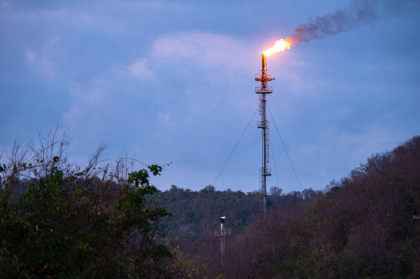 istock Smoke from Oil refinery at sunrise. environment pollution crisis concept. 1220262182