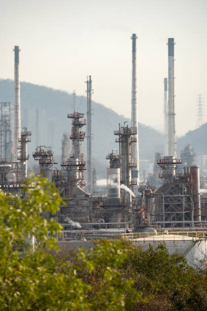 istock Smoke from Oil refinery at sunrise. environment pollution crisis concept. 1220262183