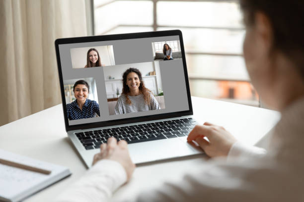 istock Woman sit at desk using laptop having video call communication 1220262452