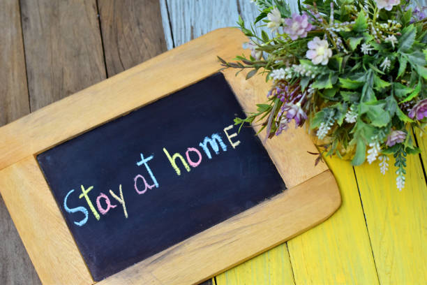 istock Stay at home save lives concept with text on board for Coronavirus Covid-19 1220262526