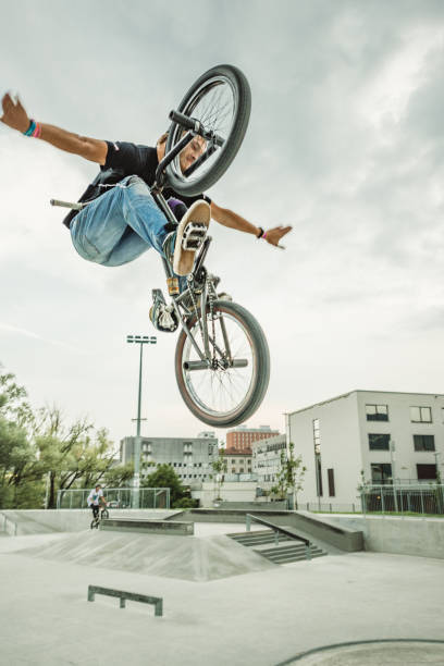 istock bmx rider jumping over a ramp 1220263215