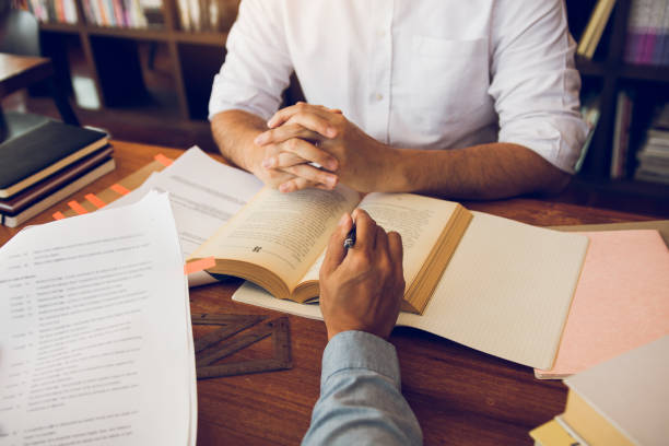 istock Teenager studying at desk and doing homeworks 1220263228