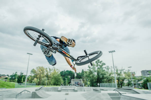 istock bmx rider jumping over a ramp 1220263418