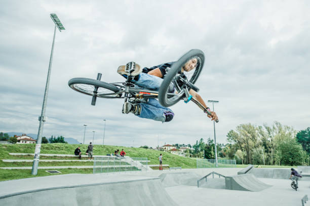 istock bmx rider jumping over a ramp 1220263529