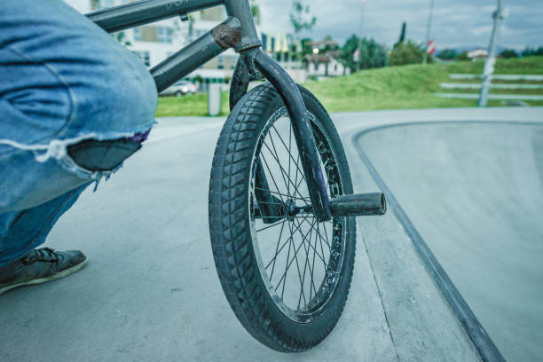 istock bmx rider jumping over a ramp 1220263597