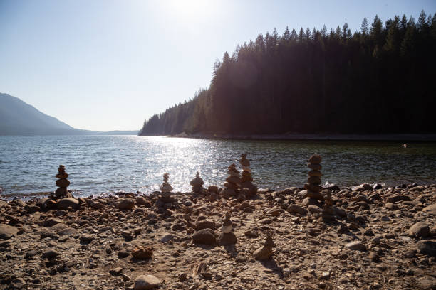 Balancing Rocks on the beach by the Alouette Lake Balancing Rocks on the beach by the Alouette Lake during a sunny winter day. Taken in Golden Ears Provincial Park, near Vancouver, British Columbia, Canada. alouette lake stock pictures, royalty-free photos & images