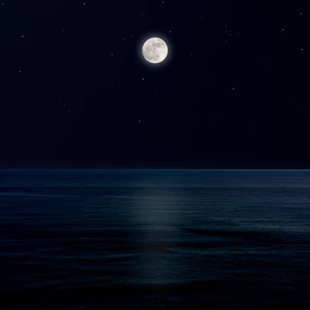 istock Full moon rising over the sea. 1220269163