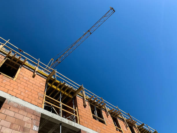 istock tower crane.  construction work of a residential multi-story brick house.  facade. 1220270352