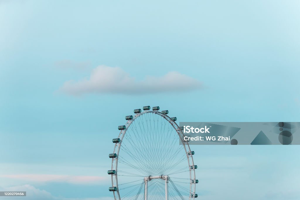 Ferris wheel under gradient blue sky Singapore Stock Photo