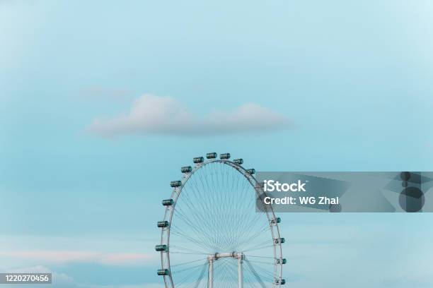 Ferris Wheel Under Gradient Blue Sky Stock Photo - Download Image Now - Singapore, Wheel, Blue